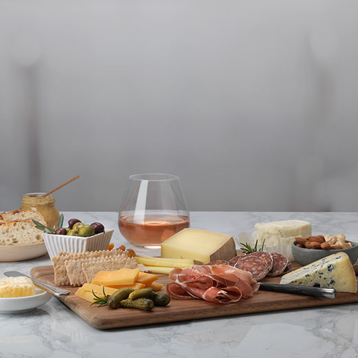 Cheese and Charcuterie Board with glass of rose