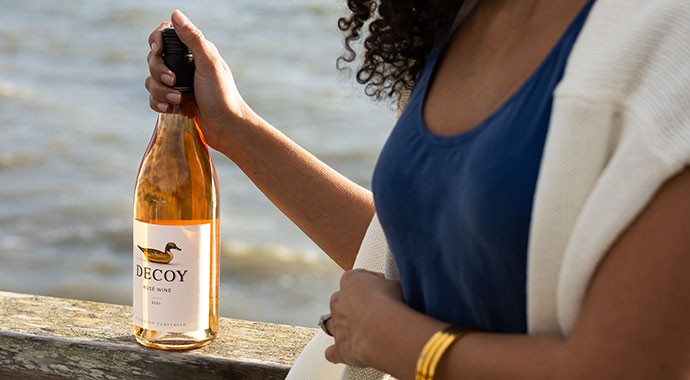 Decoy Rose being held by a woman