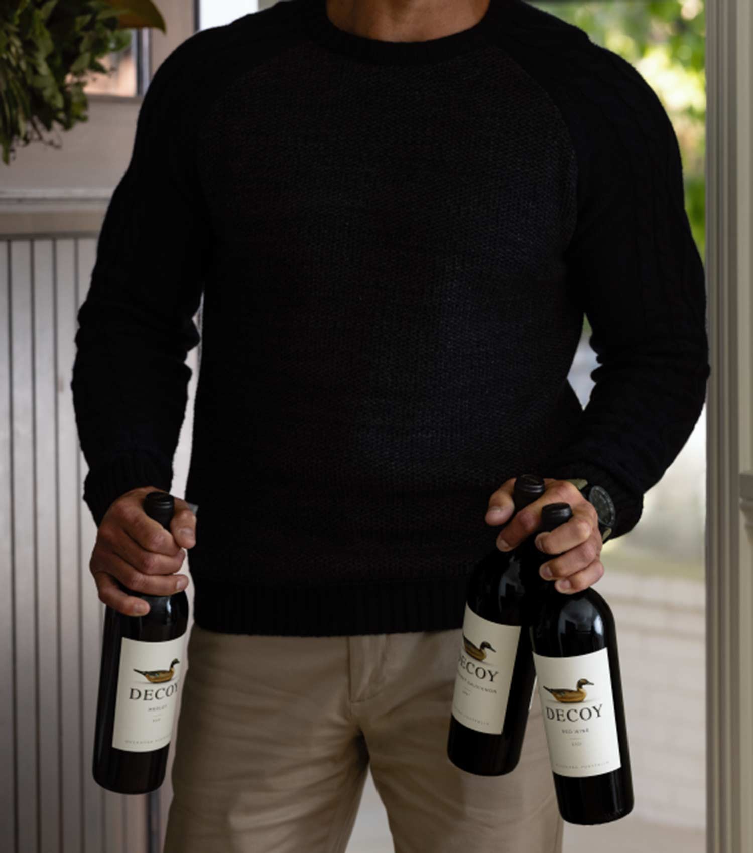 Man holding decoy wines