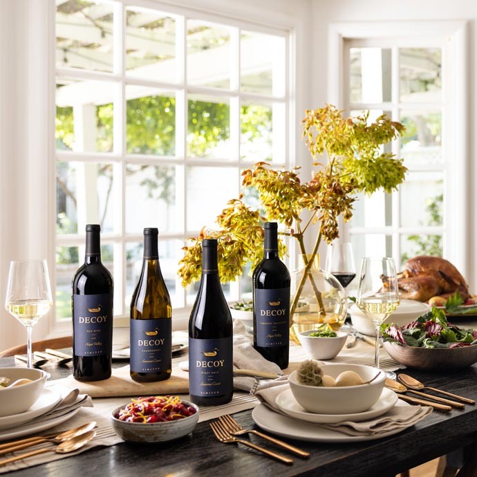 Four bottles of Decoy Limited wine bottles on a Thanksgiving table