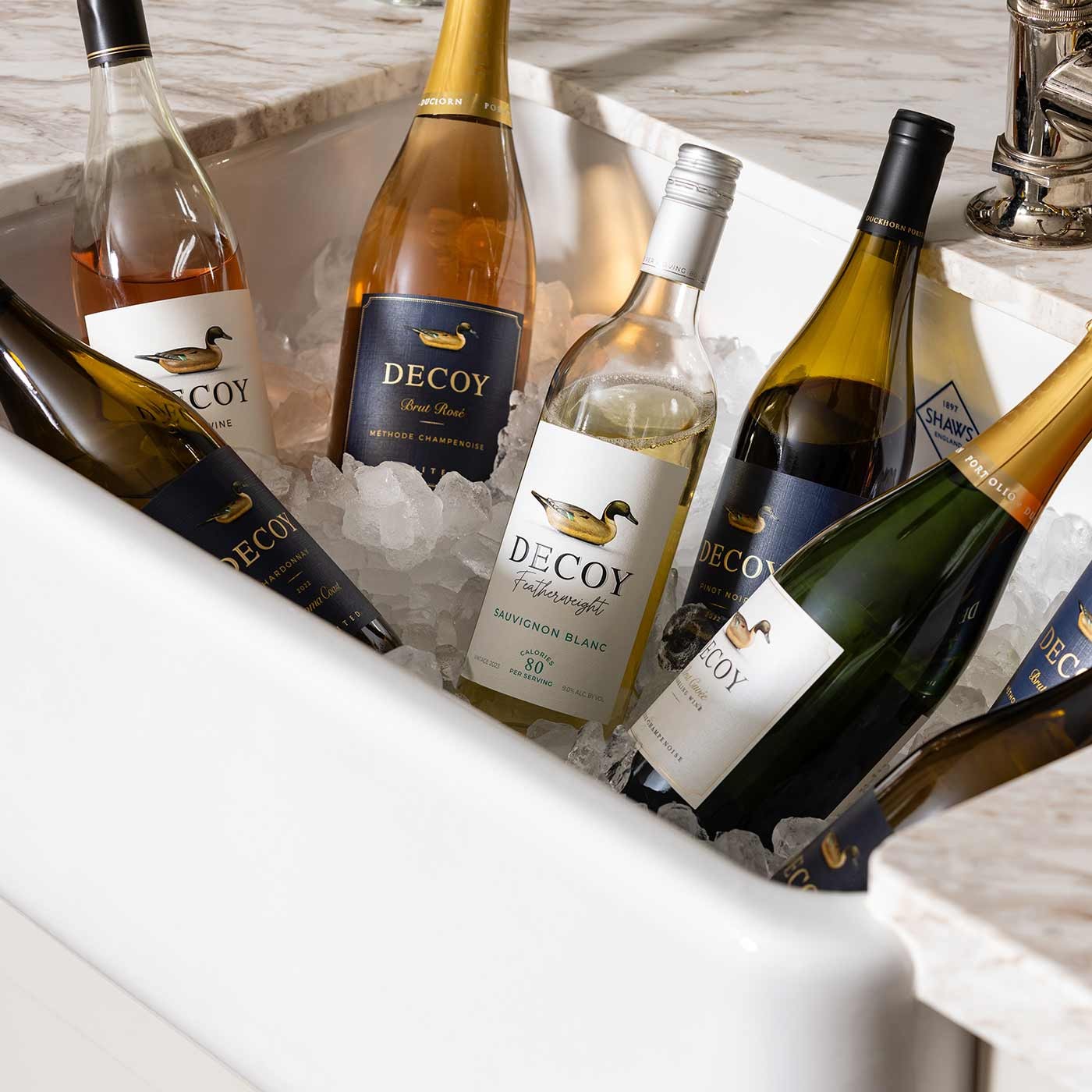 Bottles of Decoy wines on ice for summer