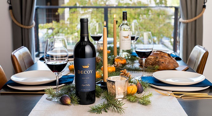 Decoy Limited Red Wine and Decoy Sauvignon Blanc on a holiday decorated table