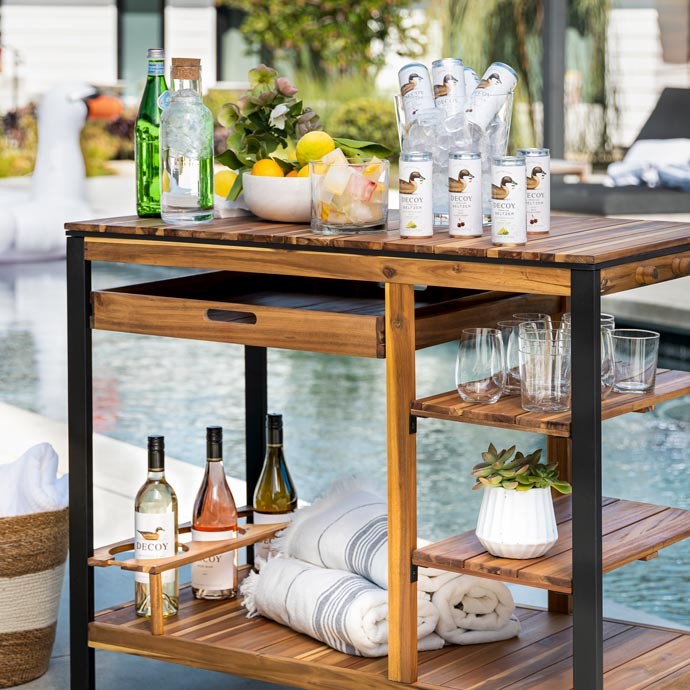 Decoy Wine Seltzers and Decoy wines on a bar cart by the pool