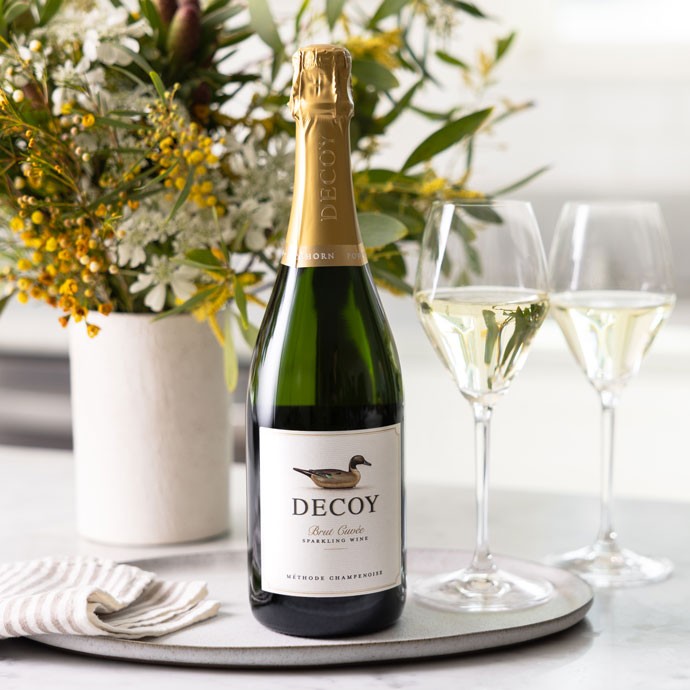 Decoy Sparkling on a counter with two glasses