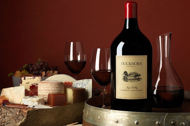Bottle of Duckhorn magnum with cheese for Midsummer Magnum Dinner event