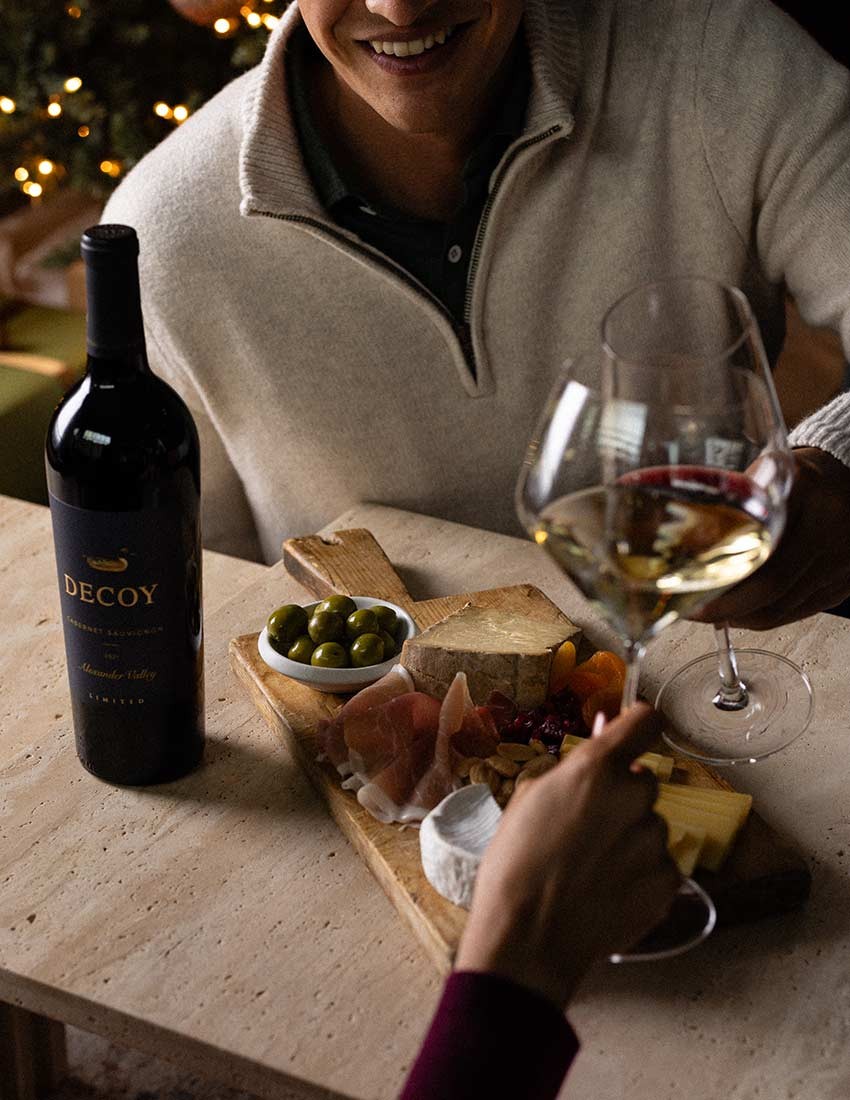 Couple enjoying wine and a cheese board